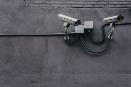 two white cctv security cameras